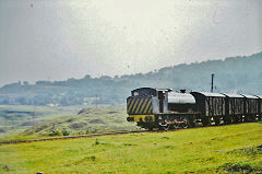 'Llewellyn' passing 'British' village, August 1973, © Photo by Richard Morgan, courtesy of Steve Thomas