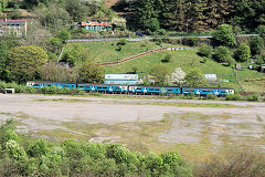 Train passing the site of coke ovens, Llandafal, Cwm, April 2011