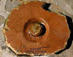 An 8 inch/200 mm diameter, glazed earthenware 'cap'
