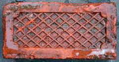 'Woodside Brick Co Cwmbran', The other side of the brick is cross hatched which is typical of stable bricks, to give a non-slip footing to horses.