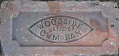 'Woodside Brick Co Cwmbran' This example came from a repaired garden wall in Pontnewydd, the house dates from approximately 1900.