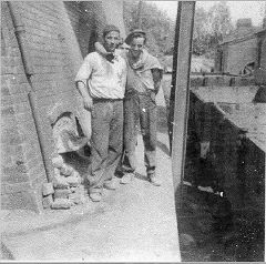 
Trimsaran Brickworks, 1955, with Terry Bates by new kiln, lean-to building with chimney in the back ground is the Blacksmith Shop leading into brick making machine shop plant, old kiln on other side of railway track , © Photo courtesy of Peter Cardwell