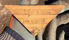 A green glazed triangular tile from J C Edwards, Ruabon, Denbighshire © Photo courtesy of Ian Evans