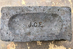 
'JCE', J.C.Edwards, Ruabon, Denbighshire, on a blue brick, © Photo courtesy of Jonathan Dooley