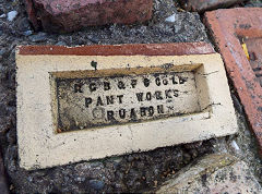 
'R G B F C Co Ld Pant Works Ruabon' on a glazed brick from Pant brickworks, Ruabon, Denbighshire,  © Photo courtesy of Kes Jones