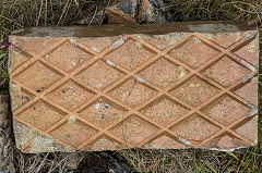 Emblem on back of paver, found at Trefil, near Rhymney