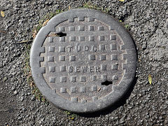 
'TUDC Sewer', for 'Tredegar Urban District Council', found in Tredegar, November 2023