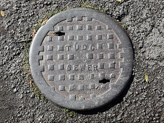 'TUDC Sewer', for 'Tredegar Urban District Council', found in Tredegar, November 2023