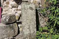 
'DB', one of a pair at Usk Castle possibly referring to 'Elizabeth de Burgh', a one-time owner.