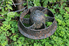 An embedded dram wheel near the Ogmore Valleys Extension Railway Bedford Road bridge, September 2020