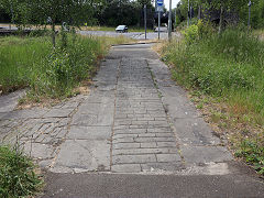 Swansea Canal bridge approach at the entrance gate to Hafod Copperworks, June 2023