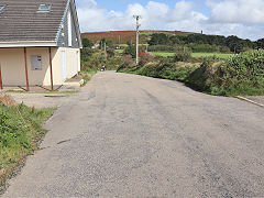 TheTresavean Line crossing the road at Lanner Centre, Penance, September 2023