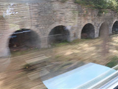 
A large bank of limekilns at Berzee, South of Charleroi, Belgium, taken at speed from the train, June 2024
